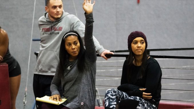 Coach Umme Salim-Beasley (center), assistant coach Michael Rosso (left) and graduate assistant coach Anastasia Halbig work with gymnasts during practice on Wednesday in Pearson Hall. | JAMIE COTTRELL / THE TEMPLE NEWS