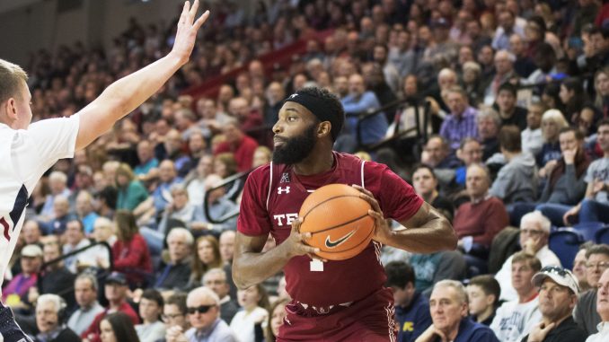 Redshirt-senior guard Josh Brown surveys his offensive options during the Owls' 60-51 win against Penn on Saturday at The Palestra. | EVAN EASTERLING / THE TEMPLE NEWS