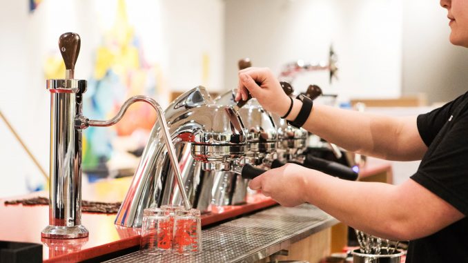 Julia Maass, a senior tourism and hospitality management major, handles an espresso machine in Speakman Hall’s student-run Saxbys, which is scheduled to open Wednesday. | SYDNEY SCHAEFER / THE TEMPLE NEWS