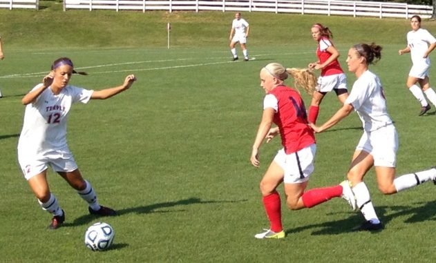 Senior defender Brittany Wollner kicks a ball out of Temple's zone. | JOHN MURROW TTN