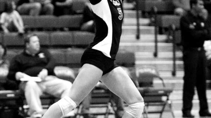 Junior outside hitter Elyse Burkert serves at McGonigle Hall. ( PAUL KLEIN / TTN FILE PHOTO )