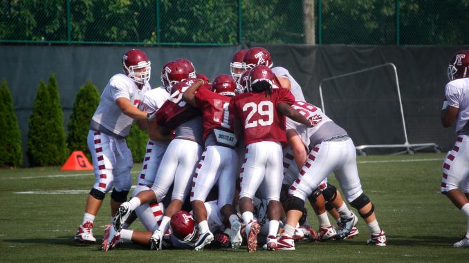 The Owls scrum during training camp practice on Aug. 13. Temple re-enters the Big East Conference this season after being kicked out of the conference in 2001 due to a lack of competitiveness. ( ANDREW THAYER / TTN )