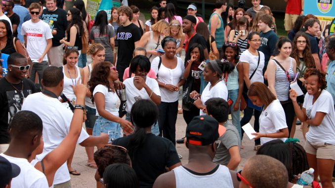 Returning students on Liacouras Walk enjoy Welcome Week activities at TempleFest.