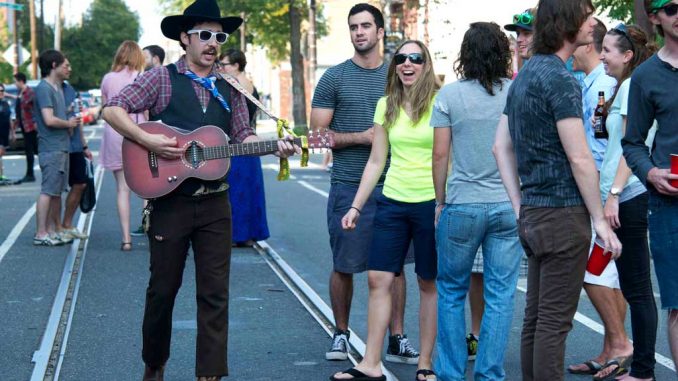 The one-man mariachi, TACO, walked up and down 12th street during the PhilaMOCA Art and Music Festival Block Party, often walking straight up to people and singing directly to them. ( CHARLOTTE JACOBSON // TTN )