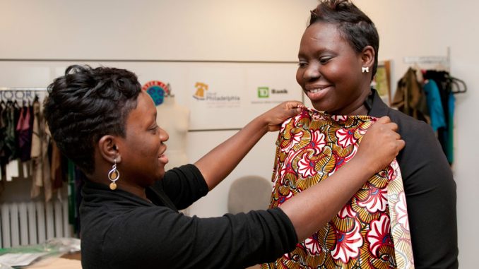 Moriamo Obajimini, left, and her sister Latifita started a global fashion company called Aso Damisa. ( ABI REIMOLD / TTN )