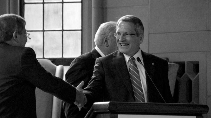 Dr. Neil Theobald is congratulated by Acting President Englert as he was approved as Temple’s next president at a Board of Trustees meeting in August. Theobald will assume the presidency Jan. 1. ( ABI REIMOLD / TTN )