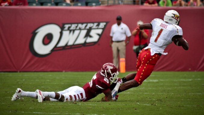 Sophomore wide receiver Brett Pierce tackles Maryland freshman wide receiver Stefon Diggs. The Owls committed four turnovers in the 36–27 loss. ( TIMOTHY VALSHTEIN / TTN )