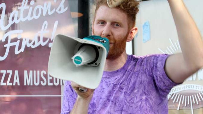 Brian Dwyer, the founder of Pizza Brain, the first-ever pizza museum, welcomed visitors for the shop's opening on Friday, Sept. 7. ( INDIRA JIMENEZ / TTN )