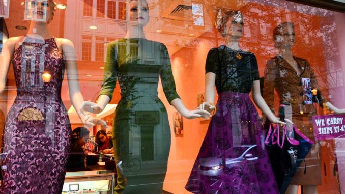 Retro dresses are displayed in the storefront of the newly opened Bettie Page on Walnut Street. | MEAGHAN POGUE / TTN