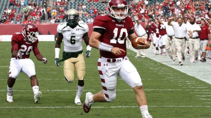 Redshirt-junior quarterback Chris Coyer finishes a touchdown run early in the first quarter of the Owls’ 37-28 win against South Florida on Saturday, Oct. 6. Coyer finished the game with with 221 yards of total offense. ( JAZMYNE ANDERSON // TTN )