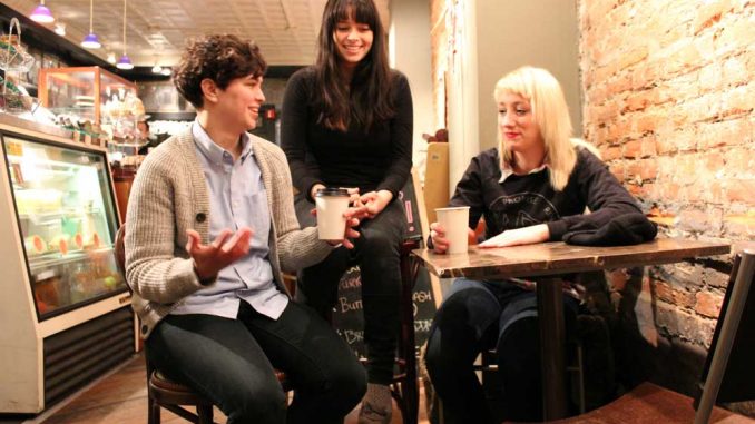 (Left to right) Bassist Allegra Anka, drummer Kelly Olsen and singer-guitarist Augusta Koch sit in Milk & Honey Café on South Fourth Street. Cayetana self-released a demo in December 2012, which has been well-received by the DIY scene. | CARA STEFCHAK / TTN