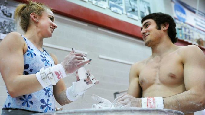 The men’s and women’s gymnastics teams practice together at McGonigle Hall. Though practice creates a sense of team unity, the Owls are forced to share space. | ABI REIMOLD / TTN