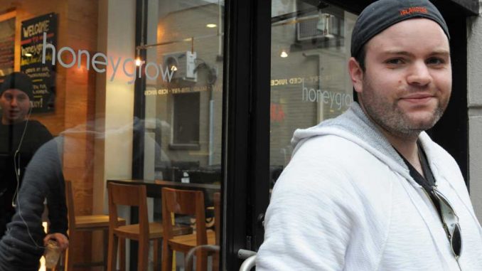 Justin Rosenberg stands in front of his store on 16th and Sansom streets. | ABI REIMOLD / TTN