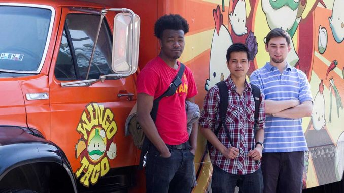 Reggie Hawkins, Sarunyoo Tohchoodee and William Shanley founded Legit Delivery, which delivers food from trucks on Main Campus to students. | LUIS FERNANDO RODRIGUEZ / TTN