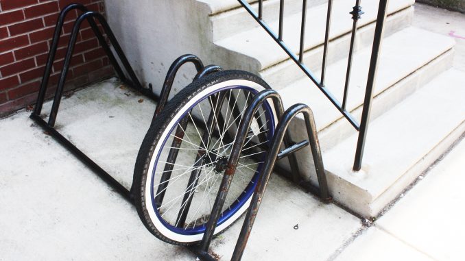 A wheel is all that is left of a bike chained to a rack on the 1500 block of North 15th Street. | John Moritz TTN