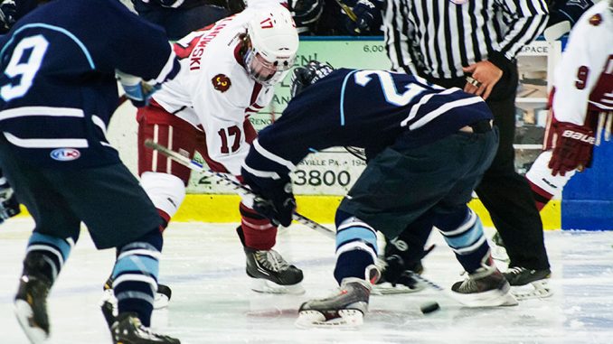 Sophomore Greg Malinowski fights for the puck in a game against Villanova. Malinowski chose to continue playing hockey after losing his nephew, Colden Malinowski, and his friend Alex Sellen. | Patrick McPeak TTN