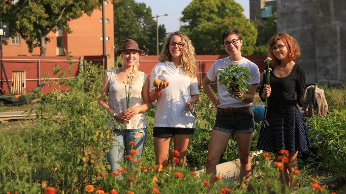 TCG members (from left) Mattie Hagermann, Sarah Andrews, Katy Ament and Joy Waldinger are the next generation of leaders at the community garden on North Broad Street. The garden allows members to grow their own food. | Hua Zong TTN