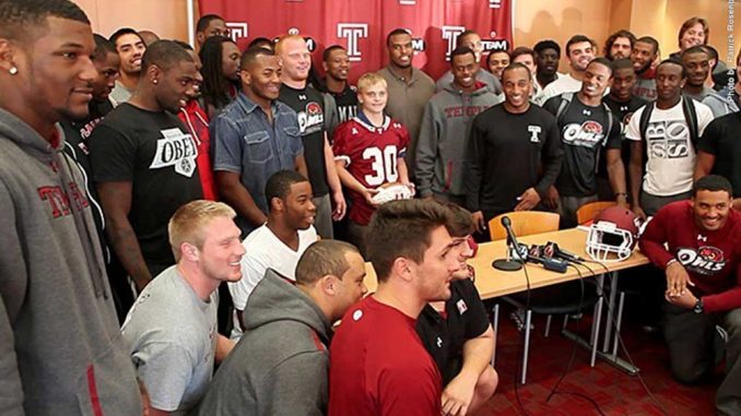 Chris Richer (middle), a 15-year-old boy, was “adopted” by the football team. | COURTESY TEMPLE ATHLETICS