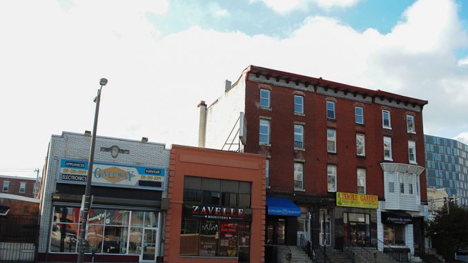 The properties to the left and right of Zavelle bookstore are set to be demolished in the spring. | Danielle Hagerty TTN