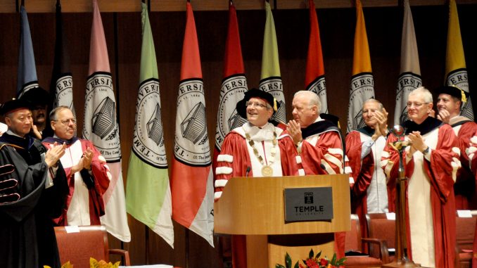 President Theobald receives a standing ovation after his inaugural address at the Performing Arts Center on Friday. | Yuxuan Jia TTN