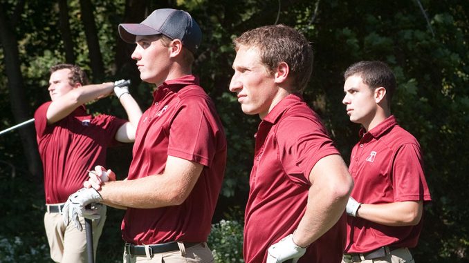 Freshman Evan Galbreath (second from right) looks onto the golf course at a recent practice. | Paul Klein TTN