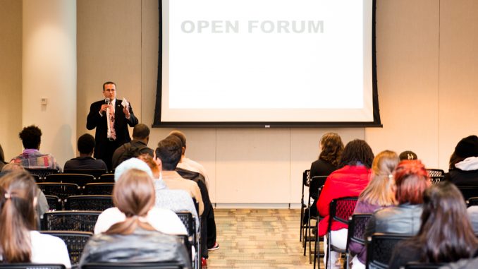 Darin Bartholomew speaks to an audience at the Temple Student Government general assembly meeting on Monday, Nov. 1. TSG announced talks with the university to address safety concerns. | Eric Dao TTN