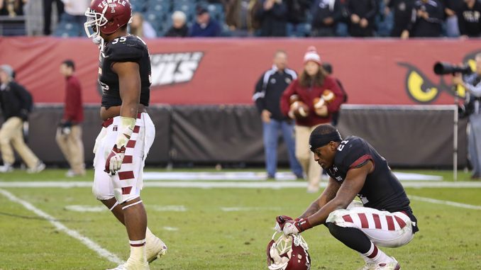 Redshirt-senior Abdul Smith crouches down and stares at the field after Central Florida’s Shawn Moffitt made a 23-yard field goal as time expired, giving the Knights a 39-36 victory as they remain undefeated in conference play. | Hua Zong TTN