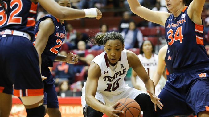 Fifth-year senior Shi-Heria Shipp dribbles through Auburn defenders during Temple’s home opening victory on Saturday. Shipp is in her first season with the Owls after transferring from George Washington. | Hua Zong TTN