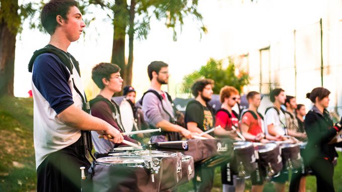 Members of the Diamond Marching Band appear in atrailer for the upcoming Martin Scorsese film, “The Wolf of Wall Street.” The student musicians said costuming, rehearsing and filming took several days. | Eric Dao TTN