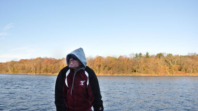 Thirty-fourth-year crew coach Gavin White looks upward during an early morning fall practice. White received his bachelor’s degree at Temple. | Jacob Colon TTN