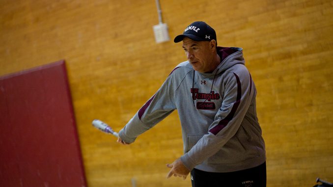 Softball coach Joe DiPietro helps his team prepare for the final season the program will compete in before it is slated to be cut in July. | Alex Udowenko TTN