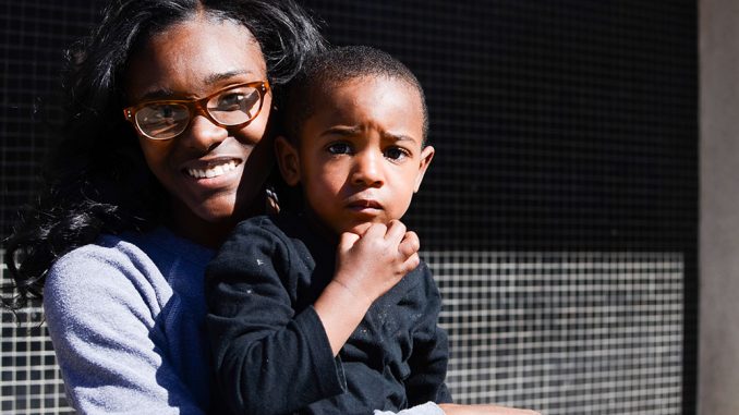 Brittany Redfern holds her son John Brice Jr., who was born during her junior year of college at Temple. | Andrew Thayer TTN