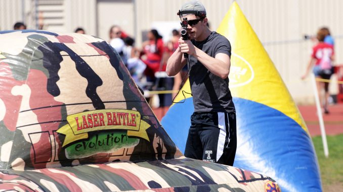 A student plays laser tag at the university-sponsored Cherry On Experience, an alternative to the canceled Spring Fling, held at the Geasey Field Complex last weekend. | Andrew Thayer TTN