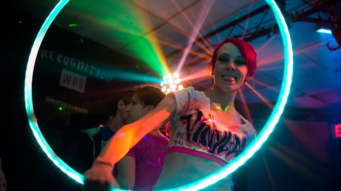 A dancer from Vinyl Doll Productions, a dance performance crew, performs with a hula-hoop at an event in the city’s Allegheny neighborhood on March 29. | Abi reimold TTN