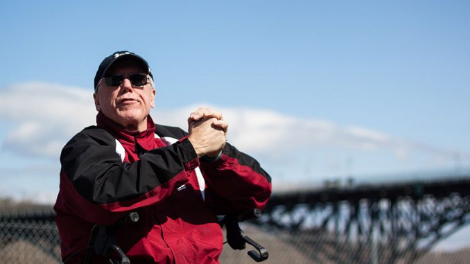 Gavin White folds his hands during a race on the Schuylkill in 2014. | KARA MILSTEIN TTN FILE PHOTO