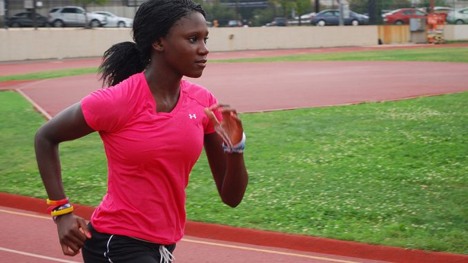 Sophomore Jamila Janneh runs around the track on Main Campus during a Fall 2012 practice. Janneh is the new school record holder in the outdoor triple jump. | Andrew Thayer TTN