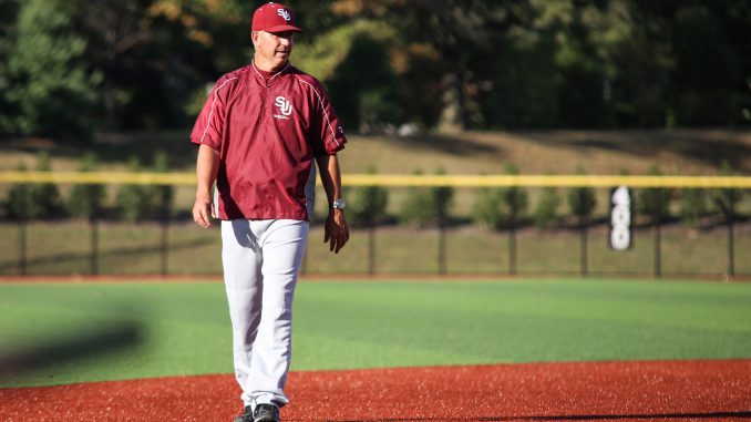 Ryan Wheeler, who now serves as an assistant coach at St. Joseph’s, watches baseball practice at Smithson Field. Andrew Thayer | TTN