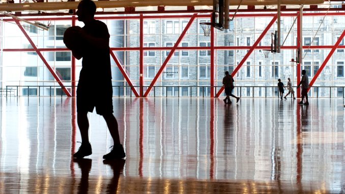 Students play basketball in the Fitness Mezzanine of Pearson and McGonigle Halls. Students can receive activity rewards through two fitness programs. Allan Barnes | TTN