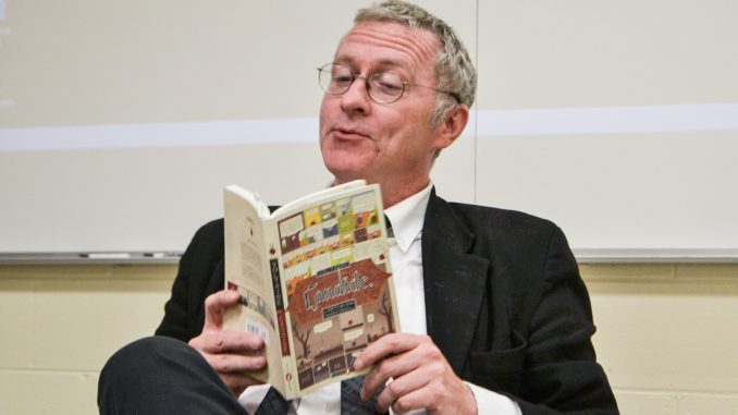 Mosiac Adjunct Professor Dan Touey reads from Voltaire’s “Candide” during a Mosiac class on Sept. 29. Andrew Thayer | TTN