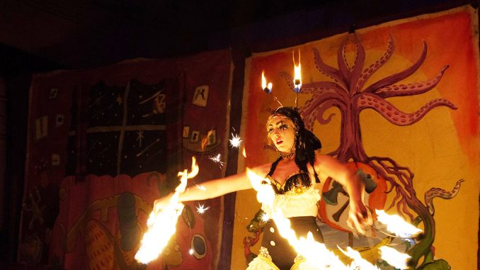 Madeleine Bell, a fire eater and dancer is among one of the acts in the underground entertainment sideshow, Carnivolution. Brianna Spause | TTN