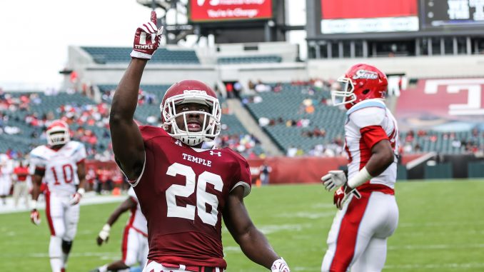 Jaime Gilmore celebrates his four-yard rushing touchdown in the first quarter of Temple's 59-0 blowout win against Delaware State Saturday. | Hua Zong TTN