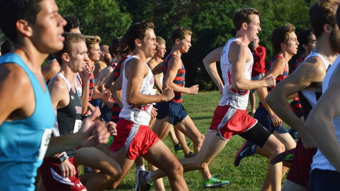 Redshirt junior Alex Izewski (second from left) races in the Big 5 Invitational Friday. Greg Fraingipani | TTN