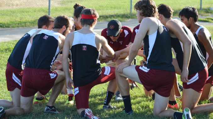 Coach James Snyder shares some final words to the men's team before its race at Belmont Plateau Saturday in the Friend Big 5 Invitational. | Greg Frangipani TTN