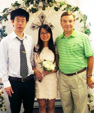 Bill DeSio (right), with Yang and his wife, Xueli Huang, on their wedding day. COURTESY CHRISTINE BRADY