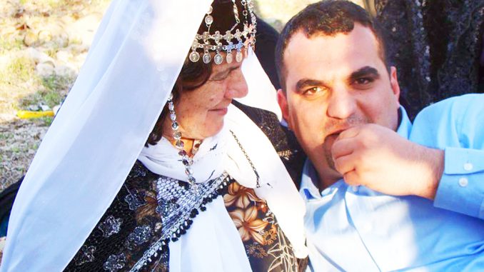 Huner Anwer sits with his grandmother during a Kurdish picnic in March 2012. COURTESY HUNER ANWER