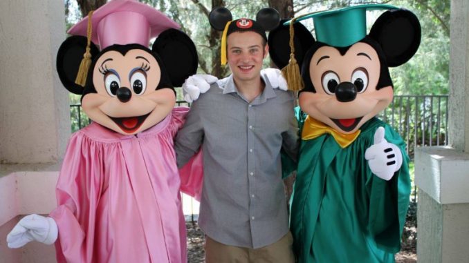 Cameron Resnick, a Temple student, stands with Mickey and Minnie Mouse after graduating from the Disney College Program. | COURTESY CAMERON RESNICK