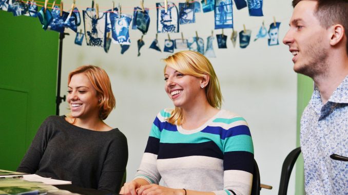 Ola Piatkowska, (left) Krista Filchner and Chris Setty, seniors at Tyler. sell their photography as regular prints or fabric prints. Jenny Kerrigan | TTN