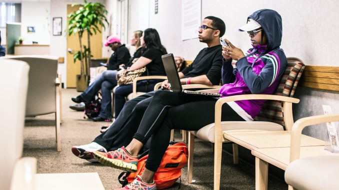 Students wait for their names to be called in the Student Financial Services office on Sept. 30. Aaron Windhorst | TTN