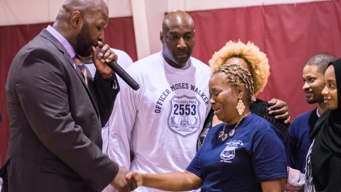 Wayne Lipscomb (right) became emotional during a local tournament held in honor of her late son, who was an officer with the Philadelphia Police. Brianna Spause | TTN