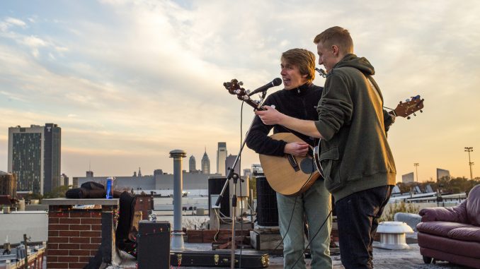 Eric Doguet and Robbie Fischer of Eric & Robbie perform at The Block Jam, a rooftop concert at the corner of Diamond and Carlisle streets, held on Nov. 9. Kara Milstein | TTN